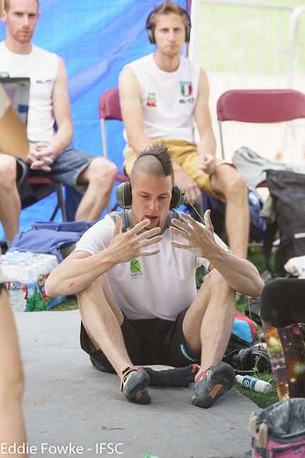 Bouldering World Cup 2016, Vail - Jernej Kruder during the six stage of the Bouldering World Cup 2016 in Vail, USA with Gabriele Moroni and Stefan Scarperi in the backgrounds