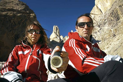 Eternal Flame, Nameless Tower, Trango, Karakorum, Pakistan - Thomas Huber and Alexander Huber showing the summit data: 6251m. Eternal Flame, Nameless Tower, Trango, Karakorum, Pakistan