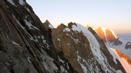 High pressure over Mont Blanc, Giovanni Zaccaria, Alice Lazzaro - Dawn breaks between the ice and rocks as Giovanni Zaccaria climbs the West Ridge of Grandes Jorasses