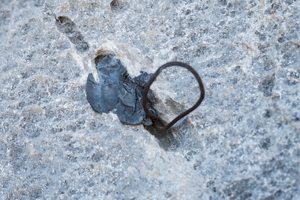 Naranjo de Bulnes, Alexander Huber, Fabian Buhl,  Picu Urriellu, Spain - Plomo, the Spanish version of the copperhead, placed by José Luis García Gallego and Miguel Ángel Díez Vives in 1983 on their climb 'Sueños de Invierno' up Picu Urriellu