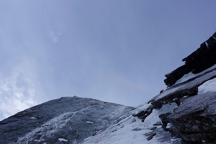 Pizzo Badile, Amore di Vetro, Marcel Schenk, Simon Gietl - Simon Gietl, nothing but a small dot in the massive face during the first ascent of 'Amore di Vetro', Pizzo Badile on 16/11/2016 