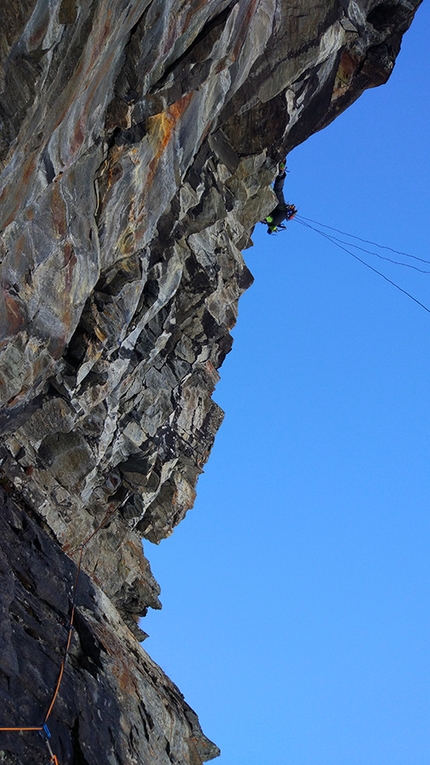 Old Boy, Cogne, Valle d'Aosta, Mauro Mabboni, Patrick Gasperini - During the first ascent of Old Boy at Cogne: Mauro Mabboni half way across the M11 traverse on pitch 2