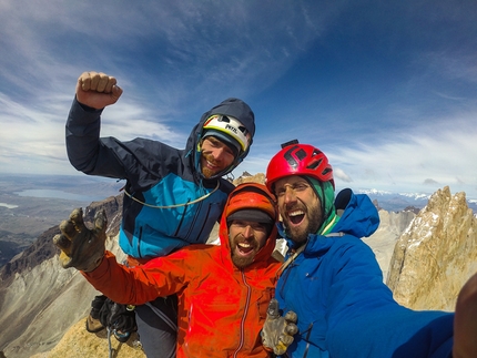 Paine Towers, Patagonia, El Regalo de Mwono, Nicolas Favresse, Sean Villanueva, Siebe Vanhee - Siebe Vanhee, Sean Villanueva and Nicolas Favresse celebrate on the summit of  Central Tower of Paine in Patagonia, after having climbed 'El Regalo de Mwono' up the mountain's East Face.