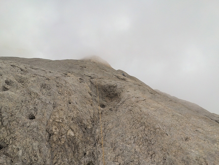 Federica Mingolla, Via della Cattedrale, Marmolada, Dolomiti, Nicolò Geremia - Federica Mingolla climbing into the whiteout during her repeat of Via della Cattedrale, Marmolada, together with Nicolò Geremia