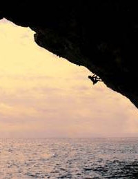 Chris Sharma, Deep Water Solo, Mallorca, Spain - Chris Sharma high above the waves, Mallorca, Spain