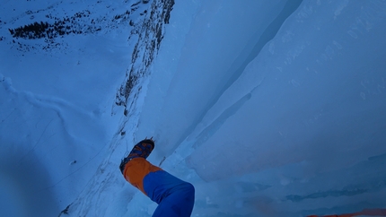 Dani Arnold, Beta Block Super, Breitwangfluh, Switzerland - The view down from the helmet of Dani Arnold during his free solo ascent of Beta Block Super up Breitwangfluh in Switzerland on 24 December 2017