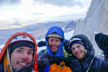 La Torcida, Aguja Val Biois, Patagonia, Tom Ehrig, Felix Getzlaff, Lutz Zybell - Aguja Val Biois, Patagonia: unfortunately not on the summit, but still super happy. Felix Getzlaff, Lutz Zybell and Tom Ehrig (from left to right) with the flag of our local climbing club back home in Germany at the ridge on top of pitch 12. Our highpoint, where our route joins the normal route to the summit, Filo Sur, and where we started rappelling down this.