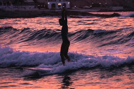 Ikaria Island, Greece, climbing - Ikaria Island: Argyro Papathanasiou surfing at dusk