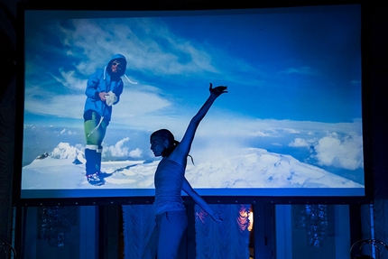 Arco Rock Legends 2018 - Arco Rock Legends 2018: Elena Friso dancing with a photo of Reinhold Messner in the background