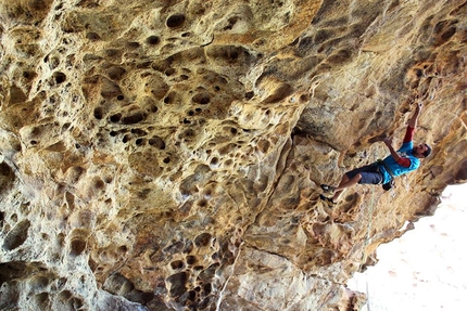 Rock climbing in Corsica in summer - Corsica climbing: Seb Curnier tackling the large overhangs in sector Mescaline