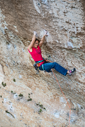 Anna Stöhr, La Rose et le Vampire, Buoux - Anna Stöhr climbing the famous crux cross through on La Rose et le Vampire 8b at Buoux, France. The long reach through caught people’s imagination and has come to be known as the Rose move.