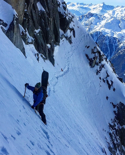 Les Drus, Mont Blan , Julien Herry, Laurent Bibollet - Laurent Bibollet traversing across the slopes of Les Drus before snowboarding down the Triple Couloir with Julien Herry