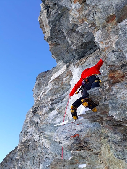 Matterhorn, Marco Farina, Marco Majori - Matterhorn West Face: Marco Majori climbing through the overhanging yellow band