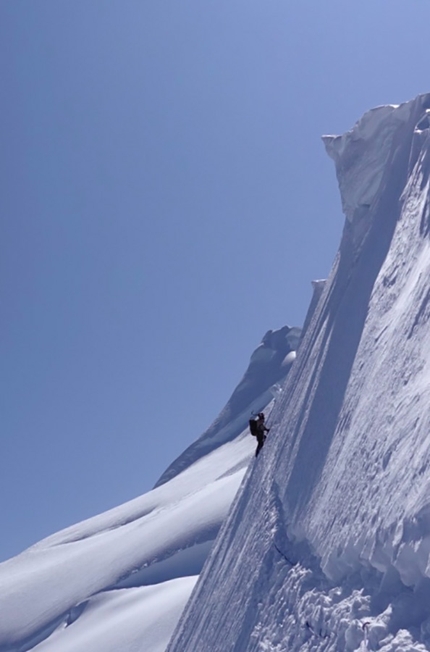 Simon Richardson, Ian Welsted - Ian Welsted traversing at the end of the Epaulette Ridge. NW Summit in background