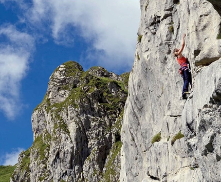 Avostanis, rock climbing above an enchanting lake in Italy Carnic Alps