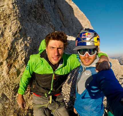 Marmolada Dolomites, Aaron Durogati, Mirco Grasso - Mirco Grasso and Aaron Durogati shortly before their paraglider flight from the ledge at half-height on the South Face of Marmolada in the Dolomites