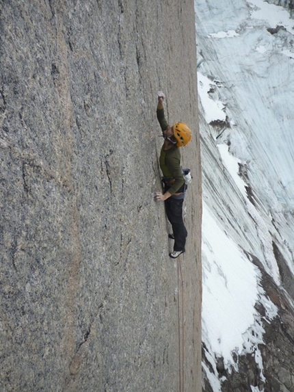 Baffin Island Mount Asgard - Mt. Asgard Baffin Island: Nicolas Favresse going for it on the heady slab of pitch 1. The granite is incredibly featured allowing us to face climb a lot.