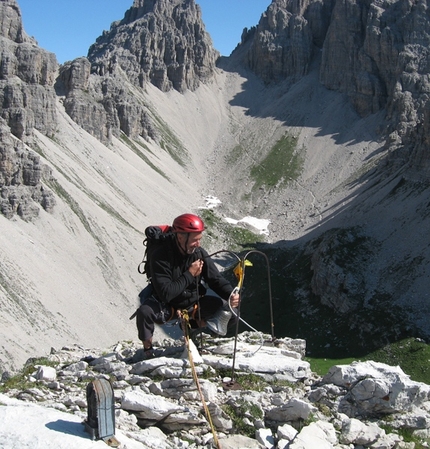 Campanile di Val Montanaia, Dolomites - Gianni Lanza ringing the bell on the summit of Campanile di Val Montanaia, Dolomites