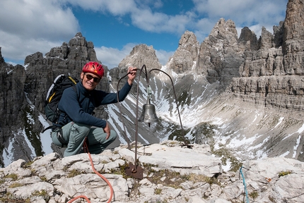 Campanile di Val Montanaia, Dolomites - Giorgio Bernasconi next to the famous bell on the summit of Campanile di Val Montanaia, Dolomites