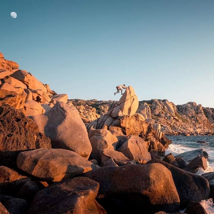 Climbing in Sardinia, Punta Contessa, Santa Teresa Gallura - Punta Contessa, Sardinia: Enrico Veronese  bouldering at the sunset