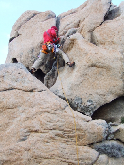 Climbing in Sardinia, Punta Contessa, Santa Teresa Gallura - Marcello Mariano climbing Scavare fosse, nutrire coccodrilli, (VI+) at Punta Contessa, Sardinia