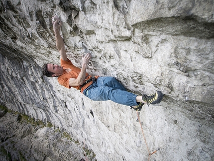 Ben Moon - Ben Moon repeating Rainshadow 9a in 2015 at Malham Cove, England.