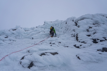 Mount Robson, Emperor Face, Canada, Ethan Berman, Uisdean Hawthorn - Ethan Berman leading into the rime features near the top of the ridge on day two while making the first ascent of Running in the Shadows on Mount Robson's Emperor Face