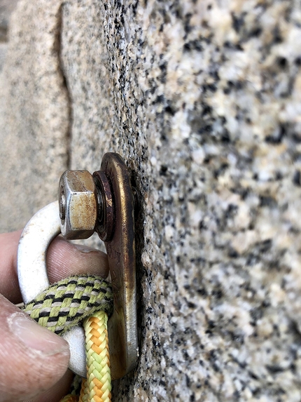 Sardinia titanium bolts - Checking an AISI 304 stainless steel climbing bolt at Capo Pecora in Sardinia