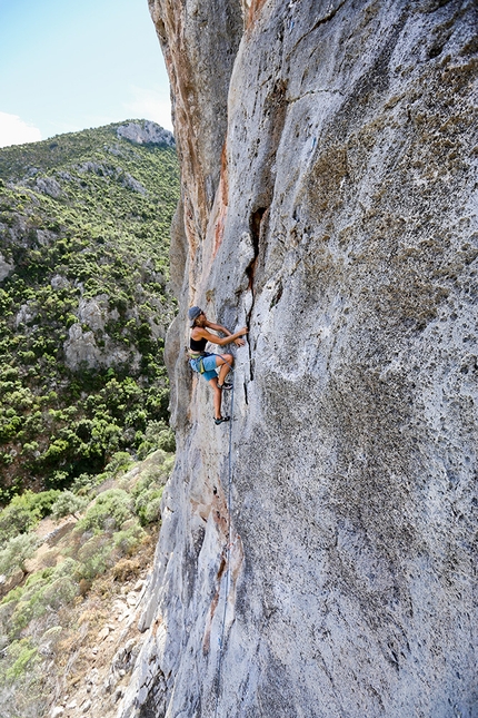 Leonidio, Arcadia, Aris Theodoropoulos - Tiia Porri on the juggy flake of Utopia 6b at Arcadia close to Leonidio in Greece