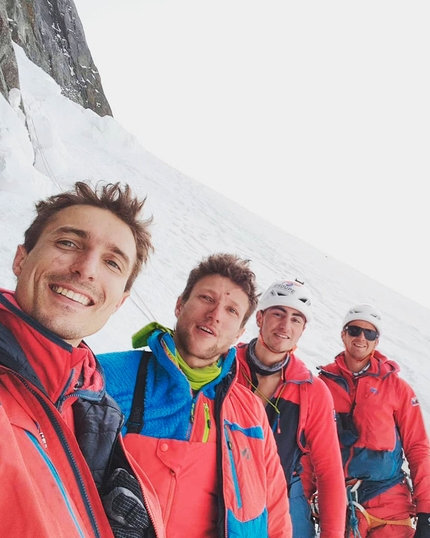 Drus West Face, Mont Blanc - Thomas Auvaro, Léo Billon, Jordi Noguere and Sébastien Ratel on summit of Petit Dru, Mont Blanc massif, after establishing BASE on the mountain's west face