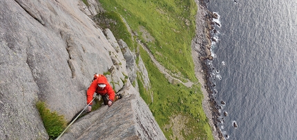 Lofoten, rock climbing, Moskensøya, Storskiva, Ørneeggen, Juho Knuuttila, Misha Mishin - Misha Mishin seconding a rare full free pitch on Ørneeggen, West Face of Mt. Storskiva on the island of Moskensøya off the Lofoten islands in Norway.