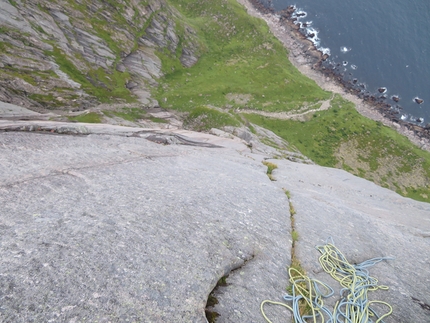 Lofoten, rock climbing, Moskensøya, Storskiva, Ørneeggen, Juho Knuuttila, Misha Mishin - Smooth walls and cracks full of grass on Ørneeggen, West Face of Mt. Storskiva on the island of Moskensøya off the Lofoten islands in Norway (Juho Knuuttila, Misha Mishin, 08/2021)