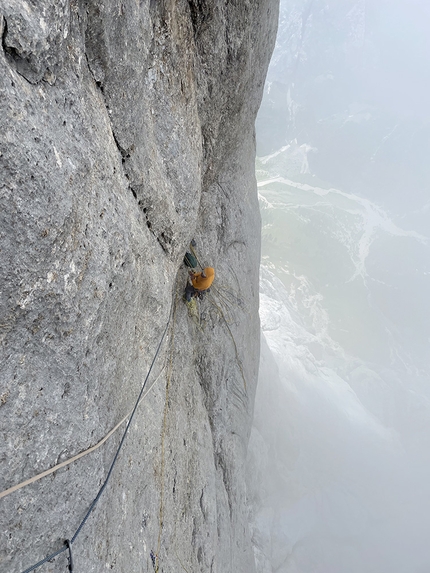 Marmolada, Dolomites, Hansjörg Auer, Much Mayr, Ultimo Tango - View down onto the belay from the crux section on pitch 7 of Ultimo Tango on Marmolada, Dolomites