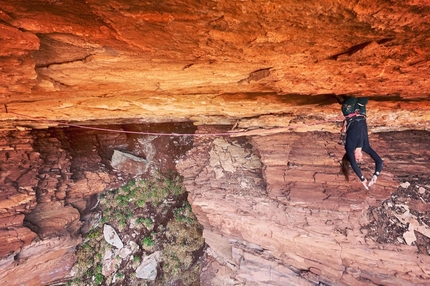 Bronwyn Hodgins, Necronomicon, Canyonlands, Utah, USA - Bronwyn Hodgins resting on Necronomicon, Canyonlands, Utah, USA. The horizontal roof crack was first ascended by Jean-Pierre Ouellet in 2011.