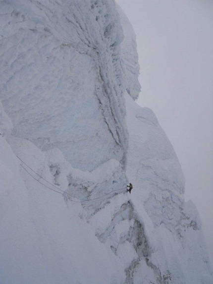 Nevado Santa Cruz - Precarious traverse beneath the serac which supports the Gran Gendarme.