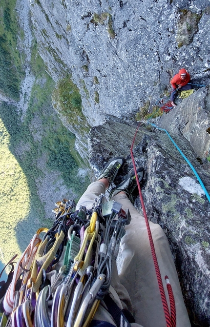 Tågveggen, Norway, Eivind Hugaas, Kalle Olsson - Skapelsen on Tågveggen in Norway: Nelson Muir Neirinck belaying on the 9th belay with a grand exposure below.