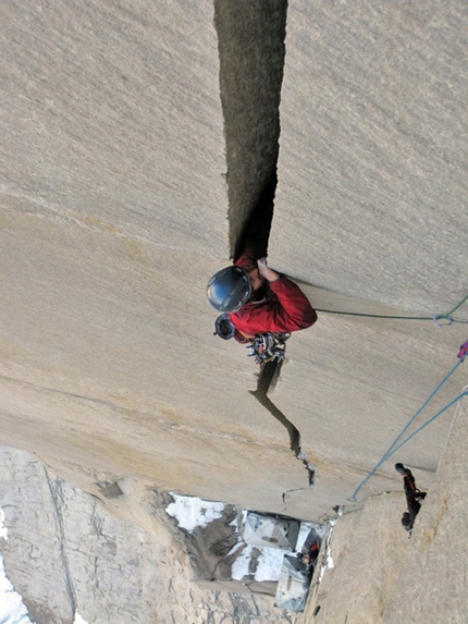 South African route Central Tower East Face - South African route: South African route, East Face Central Tower, Paine, Chile Nico disappearing into an offwidth.